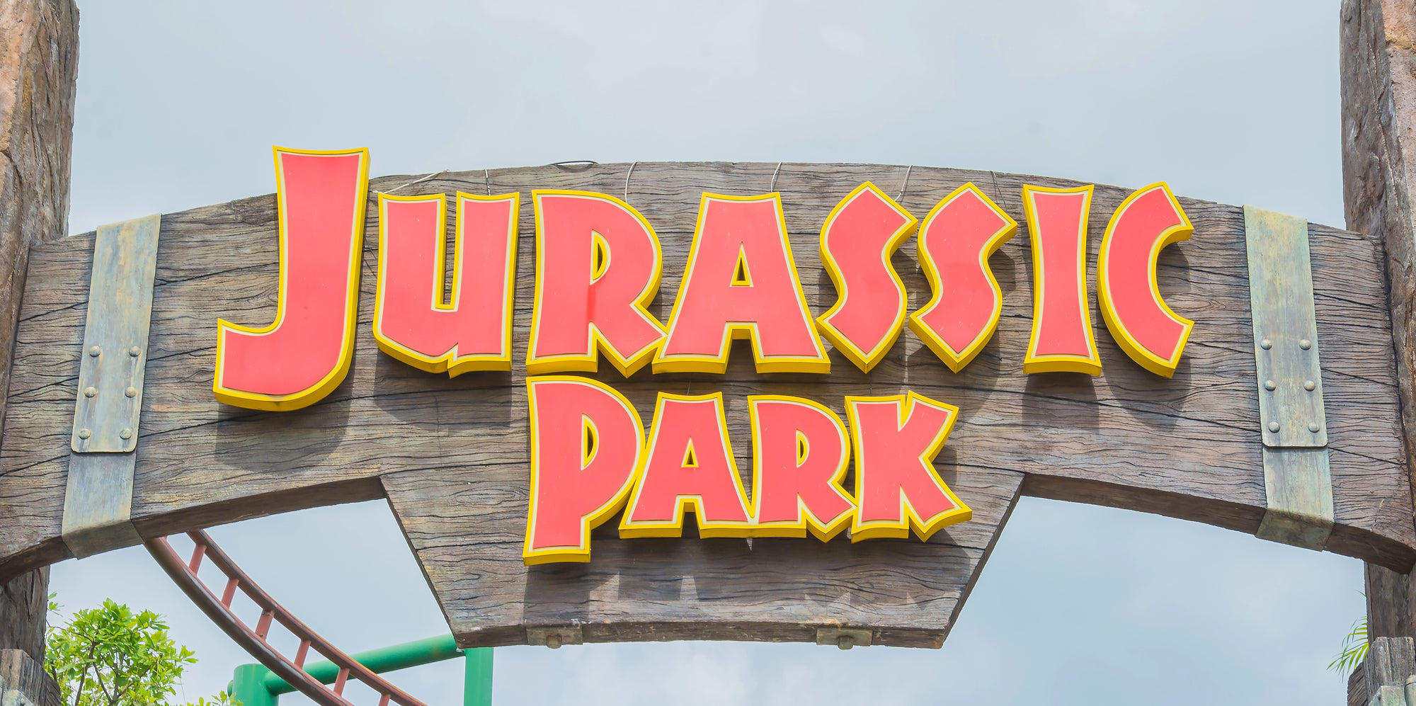 A closeup of the wooden Jurassic Park sign at Universal Studios in Singapore.