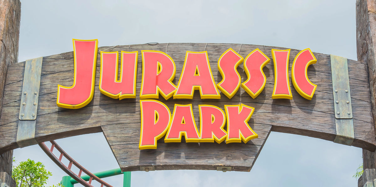 A closeup of the wooden Jurassic Park sign at Universal Studios in Singapore.